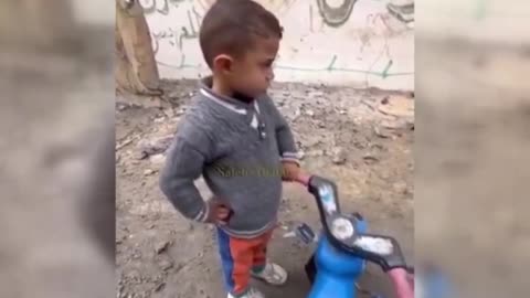 Heartbreaking video shows a child in Gaza playing next to dead bodies