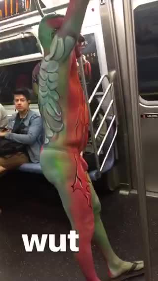 Green and red body costume subway