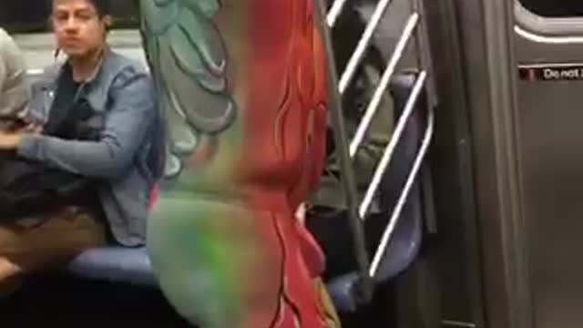 Green and red body costume subway