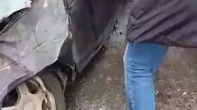 Civilians help elderly man out of car after TANK passed by him. #Ukraine - 16