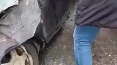 Civilians help elderly man out of car after TANK passed by him. #Ukraine - 16