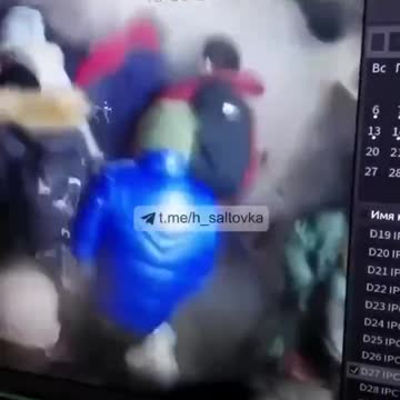 A Russian shell crashes into a supermarket in Kharkov.