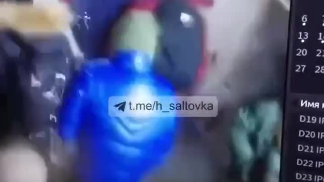 A Russian shell crashes into a supermarket in Kharkov.