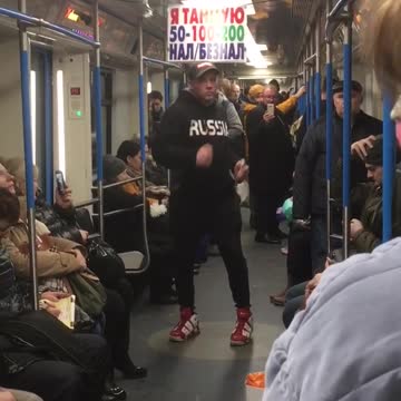 Guy black sweater jacket dancing subway train