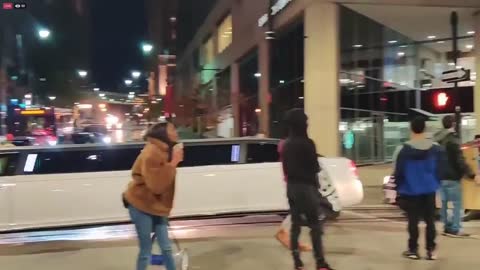 Kansas City protests. Black woman oman gets out of car and shouts at protesters holding up traffic.