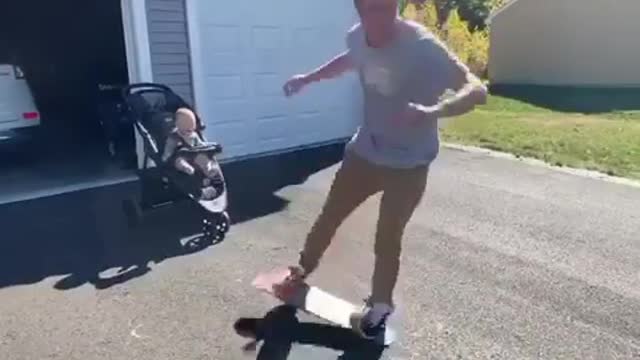 Toddler's priceless reaction to dad's awesome skateboard skills