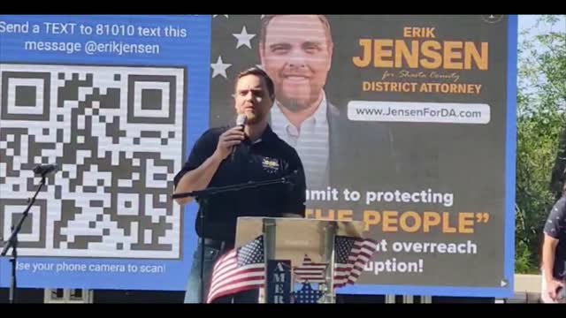 Erik Jensen speaks at the Rally on the River