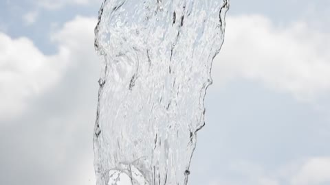 Water falling with the sky in the background