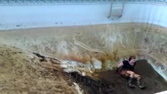 Woman Can't Escape Gross Muddy Swimming Pool