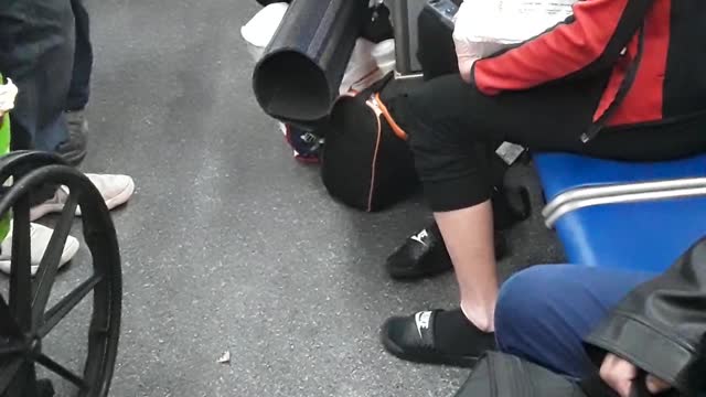 A standing-room-only Broward County '1' bus, and a loud talkative man in a wheel-chair.