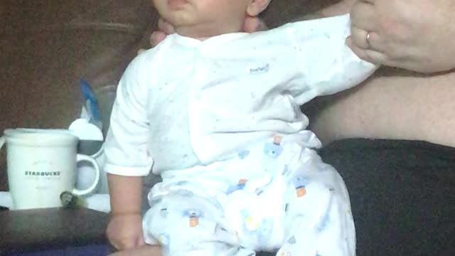 Adorable Baby Looks Around Sitting Down