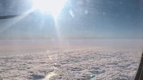 Cloud cotton candy outside the airplane window