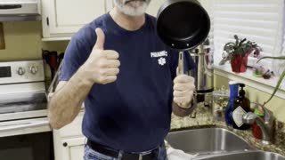 A Man Washes Dishes