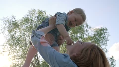 Mother plays with her baby FHD