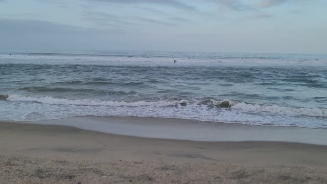 4k surfers Huntington Beach surfers not at paradise beach not Australia