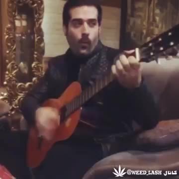 Guy playing guitar and singing Ebi's song