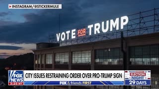 Giant Trump sign triggers lawsuit by Democrat mayor.