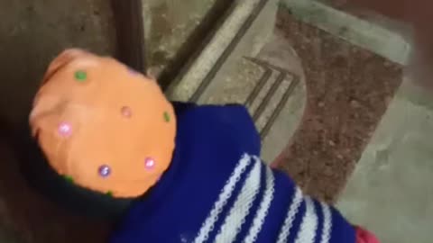 Cute Baby Bowing in Front of The Temple