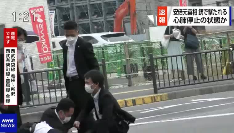 Former Japan Prime Minister, Shinzo Abe, being shot.