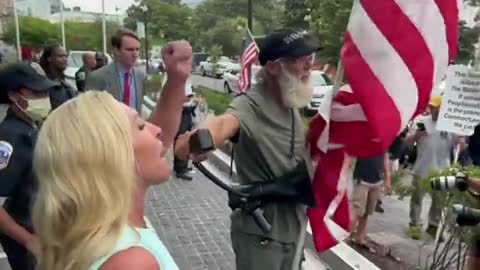 MTG walks right up to anti-Trump protesters and grabs a megaphone...