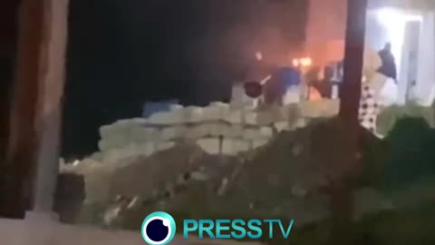 Israeli settlers torching a house and attempting to set fire to a car