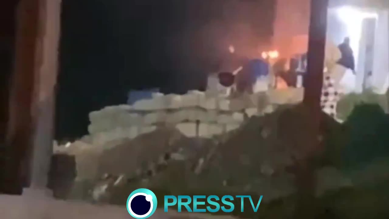 Israeli settlers torching a house and attempting to set fire to a car