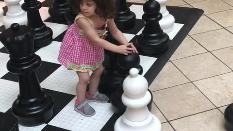 Playing chess with herself