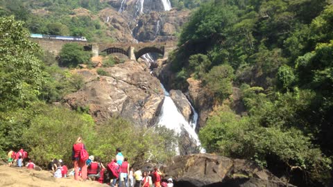 Train and beautiful waterfall