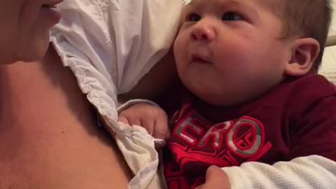 Adorable 2 months old infant first attempts to talk