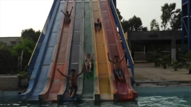 Five Boys Taking Slide Togather At Swimming Pool!