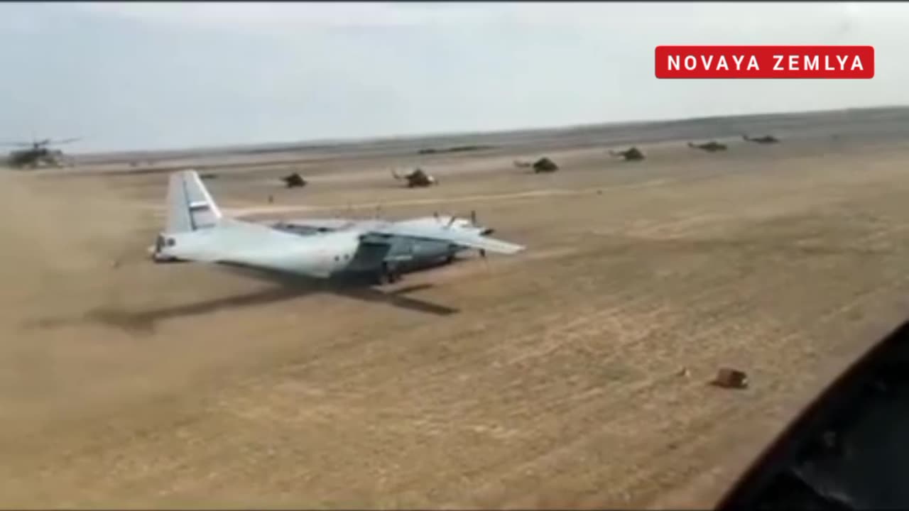 The take off & landing of Russian An-12 on dirt runway with Mi-24 escort in Libya Base