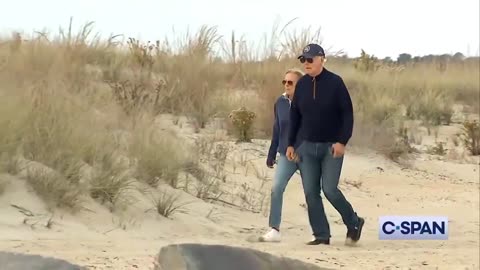 Biden struggles to walk in the sand at his beach house in Delaware