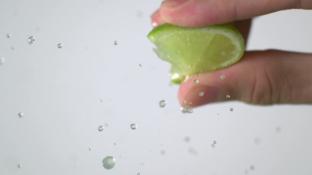 Squeezing Slice of Lime Super Slow Motion
