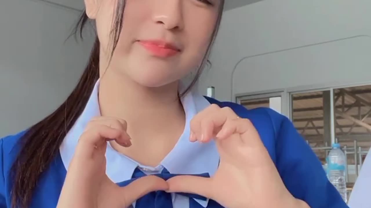 Thai cute girl with love sign