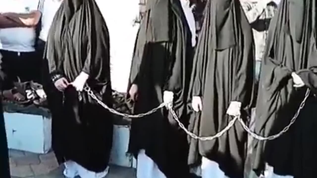 This is an Islamic Sex Sclave market in Iraq women with Burka are sold and they are in chains.