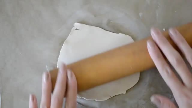 Take the clay and roll it flat