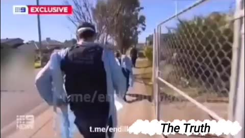 Police in Australia remove a man suspected of having Covid