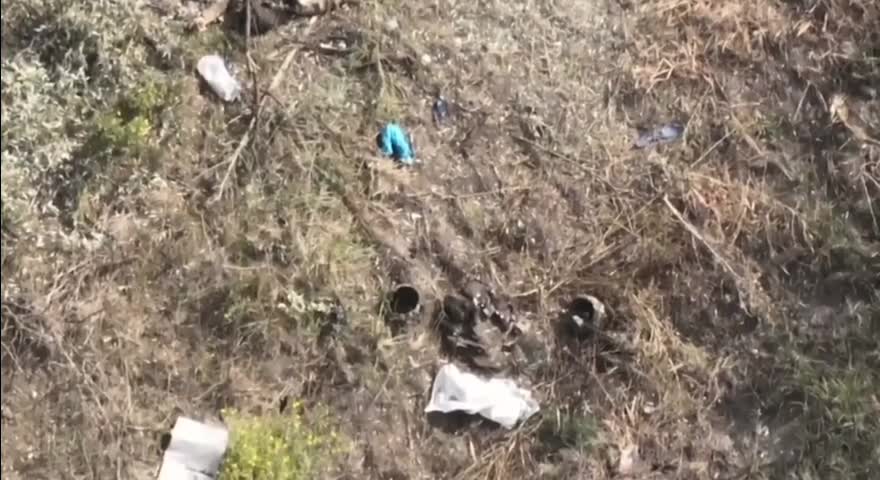 Ukrainian soldiers lay dead in a trench