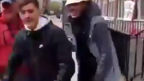 Migrant men shout "F*ck Irlanda" outside the International Protection Office in