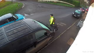 Cyclist Slips on Ice and Slams Car