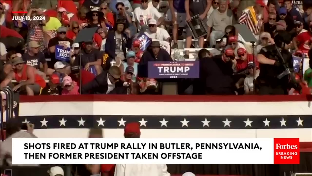 BREAKING_NEWS__Shots_Fired_At_Trump_Rally,_Former_President_Pumps_Fist_As_He_s_Rushed_Off_Stage(480p