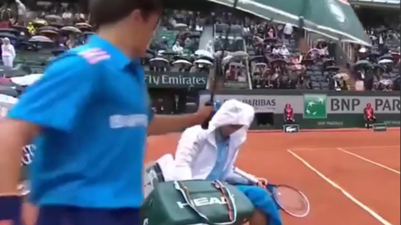 Novak Djokovic Welcomes Ball Boy to Sit Under His Umbrella