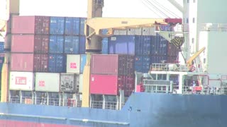 Cargo ship sailing into Port of Songkhla city in Thailand