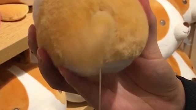 A dog toy that is waging its tail very funny, make you smiling always