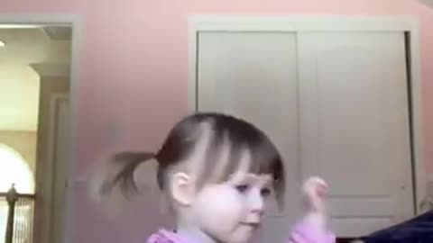 Cute baby dancing on camera