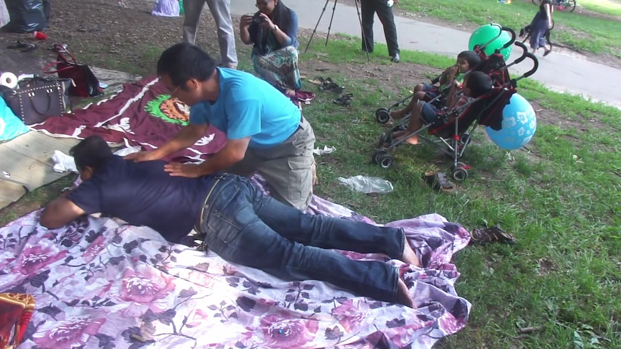 Luodong Massages Reluctant Man On Picnic Blanket