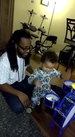 Toddler Learning The Drums Hits Dad In The Face With Drum Stick