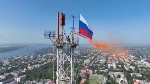 Russian officers hoisted a tricolor in Kherson.