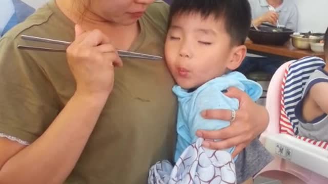 Toddler can't decide between sleeping and eating