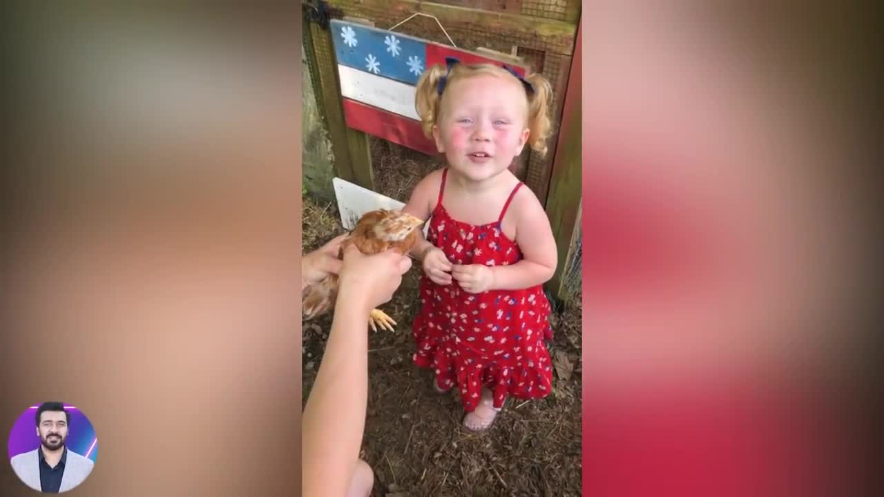 Cute baby reaction when play with chicken